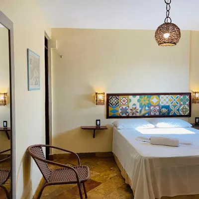 Uma cama ou camas num quarto em Pousada Fortal Villa Praia
