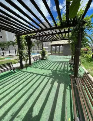 Um jardim no exterior de Apartamento próximo ao aeroporto