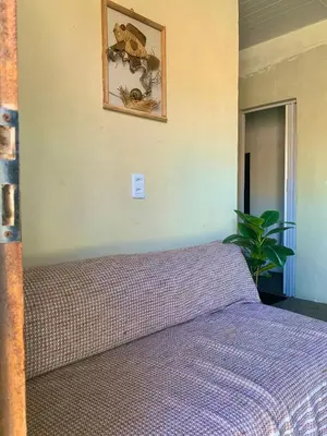 Uma cama ou camas num quarto em L2 Localize casa na praia pontal