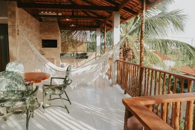 Uma varanda ou terraço em Vila hangloose pôr do sol