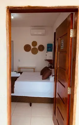 Uma cama ou camas num quarto em Suite casal na praia do Preá