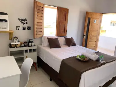 Uma cama ou camas num quarto em Suite casal na praia do Preá