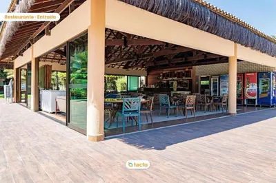 Um restaurante ou outro lugar para comer em Studio charmoso no VG de frente à piscina