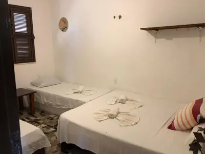 Uma cama ou camas num quarto em ITACUPA - Pousada & Foil Center