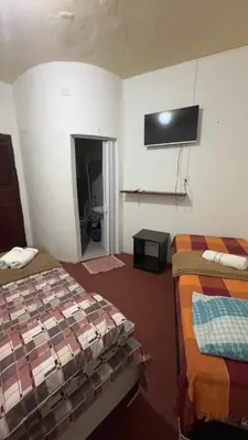 Uma cama ou camas num quarto em Pousada Capitólio 04 Canoa Quebrada