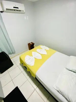 Uma cama ou camas num quarto em Felicità Praia Hotel