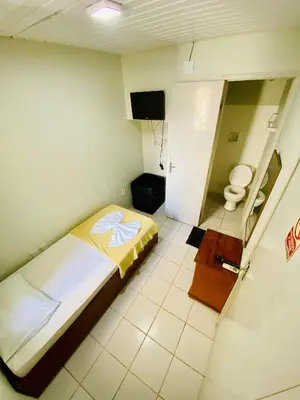 Uma cama ou camas num quarto em Felicità Praia Hotel