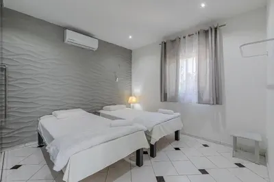 Uma cama ou camas num quarto em Casa com Piscina em Porto das Dunas by Carpediem