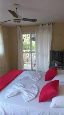 Uma cama ou camas num quarto em Pousada Rota Do Beija Flor PACOTI-CE