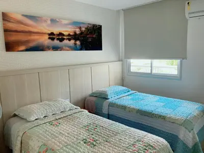 Uma cama ou camas num quarto em Ap 3 suítes Nascente Golfville Resort próx Beach Park