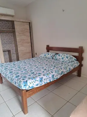 Uma cama ou camas num quarto em Pousada leblon