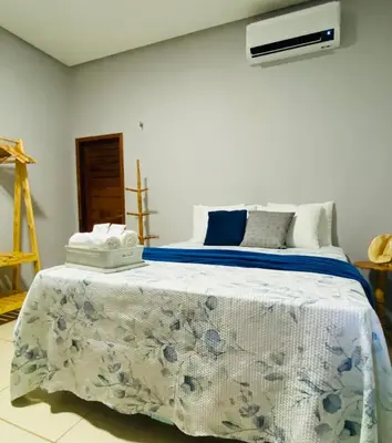 Uma cama ou camas num quarto em Casa com Piscina Privativa - Perto da Lagoa do Paraíso