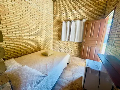 Uma cama ou camas num quarto em Casa De Praia 9 quartos Em Aguas Belas, CE