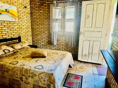 Uma cama ou camas num quarto em Casa De Praia 9 quartos Em Aguas Belas, CE