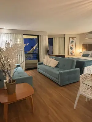 Uma área de estar em Flat 912 - Iate Plaza Hotel