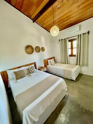 Uma cama ou camas num quarto em Casa Ariacó