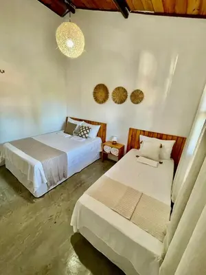Uma cama ou camas num quarto em Casa Ariacó