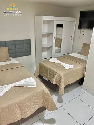 Uma cama ou camas num quarto em Hotel Aconchego Cearense