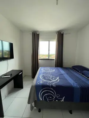 Uma cama ou camas num quarto em Apto com Ar com vista para praia de Morro Branco - Fortaleza