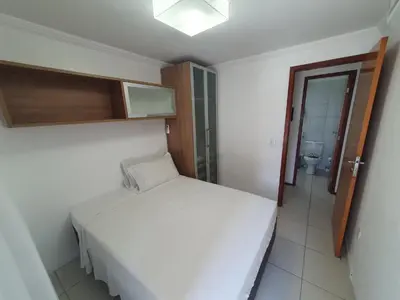 Uma cama ou camas num quarto em Ed Terraço Atlantico 1011 lateral vista mar