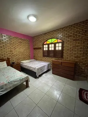 Uma cama ou camas num quarto em Sítio Correntes Mulungu