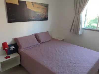 Uma cama ou camas num quarto em Apartamento Porto Beach Residence