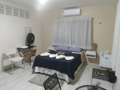 Uma cama ou camas num quarto em Pousada Suítes Meireles