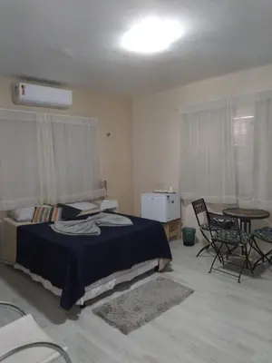 Uma cama ou camas num quarto em Pousada Suítes Meireles