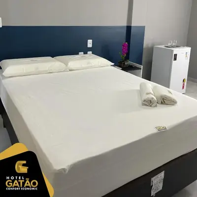 Uma cama ou camas num quarto em HOTEL GATAO