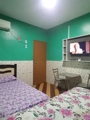 Uma cama ou camas num quarto em Pousada Pouso Feliz