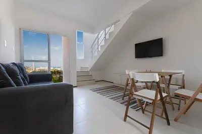 Uma televisão e/ou sistema de entretenimento em Beach Townhouses #C13 - Apartamento por Carpediem