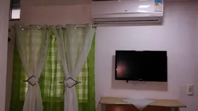 Uma televisão e/ou sistema de entretenimento em Pousada Brenda