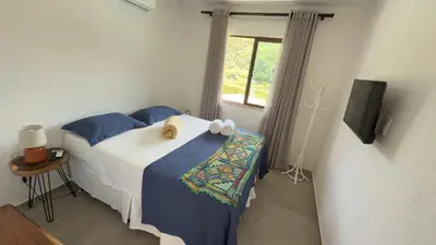 Uma cama ou camas num quarto em Pousada do Lago