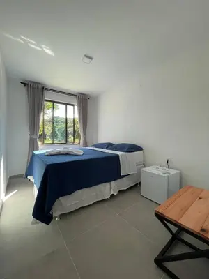 Uma cama ou camas num quarto em Pousada do Lago