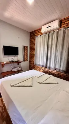 Uma cama ou camas num quarto em Suítes Green Village Flecheiras