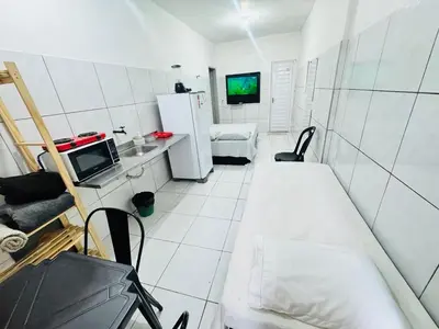 Uma televisão e/ou sistema de entretenimento em Ap no Derby com Garagem