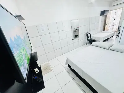 Uma televisão e/ou sistema de entretenimento em Ap no Derby com Garagem