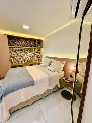 Uma cama ou camas num quarto em Apartamento Aquarius Residence