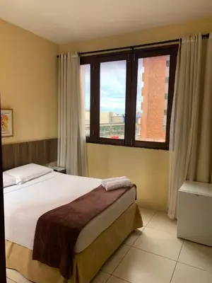 Uma cama ou camas num quarto em Ocean Praia Hotel