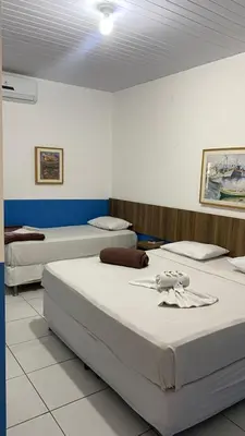 Uma cama ou camas num quarto em Ocean Praia Hotel