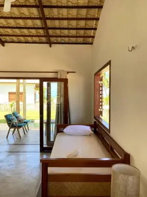 Uma cama ou camas num quarto em Casa Cajueiro - Os Navegantes