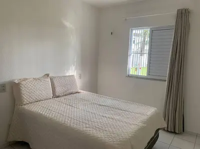 Uma cama ou camas num quarto em Apt no Icaraí mobiliado de frente para a praia.