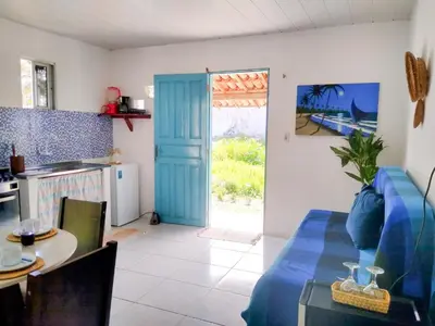 Uma televisão e/ou sistema de entretenimento em Casinha Estrela do Mar o Oceano aos seus Pés