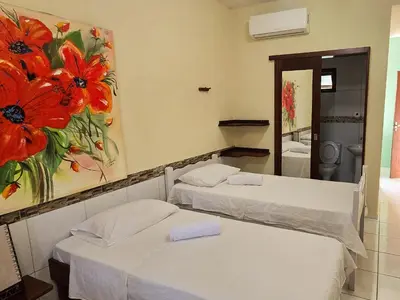 Uma cama ou camas num quarto em Pousada Viva Praia