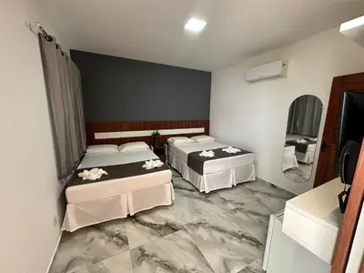 Uma cama ou camas num quarto em WL IMPERIO HOTEL POUSADA
