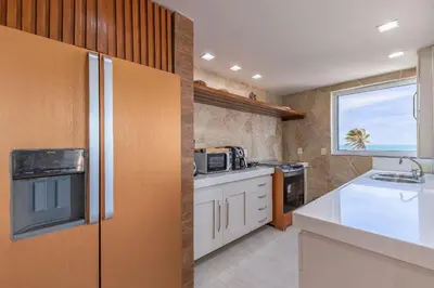 A cozinha ou kitchenette de Portamaris #301 - Cobertura de luxo por Carpediem