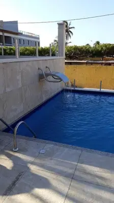 A piscina em ou perto de Flat aconchegante a uma quadra da praia