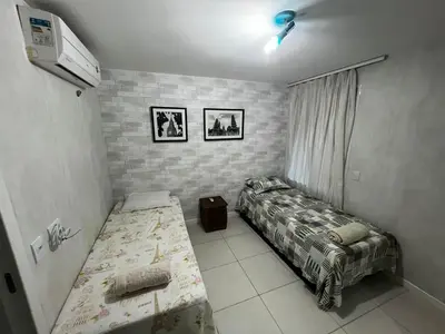 Uma cama ou camas num quarto em Apartamento GolfVille Residence
