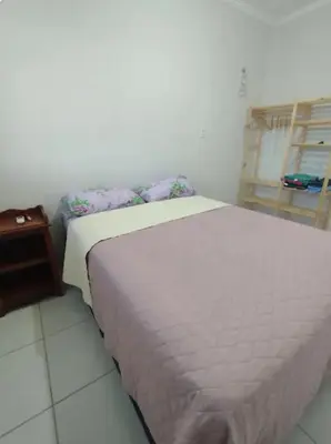 Uma cama ou camas num quarto em Refúgio tranquilo em bairro aconchegante