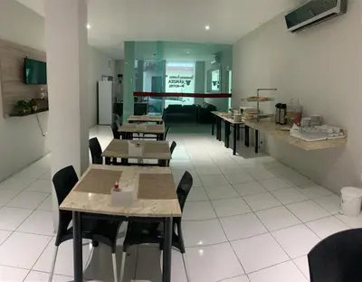 Uma área de estar em Várzea HOTEL